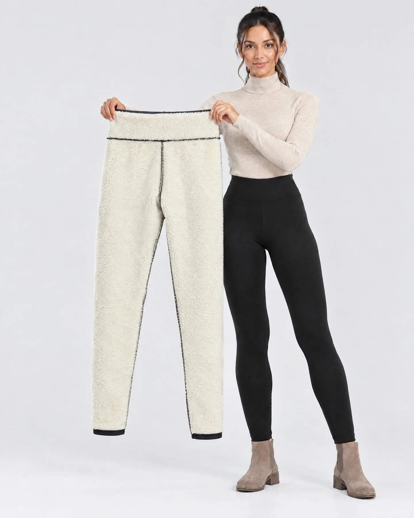 Woman holding up Everest fur leggings to show the sherpa lining