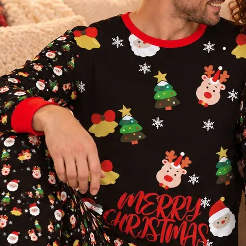 Close-up of the black pajama top: Santa, reindeer, Christmas tree and bell print, red crew neck, red cuff and Merry Christmas in red